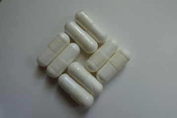 8 magnesium citrate capsules in a shape of basketweave pattern