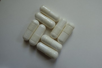 White capsules in a shape of basketweave pattern