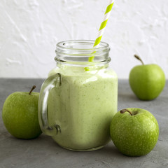 Healthy detox green smoothie in a mason jar.