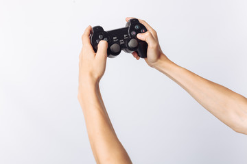 The image of hands that play games, stick, white background, insert text , advertising,
