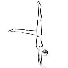 Obraz premium A young, agile gymnast standing on his hands