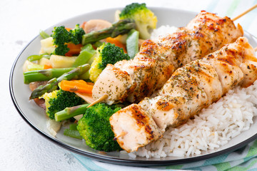 Chicken skewers with steamed vegetables and long rice