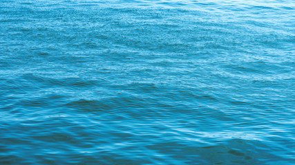 Sea surface as natural background, color toned.