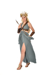 full length portrait of pretty blonde lady wearing fantasy toga gown,  and holding a bow and arrow....