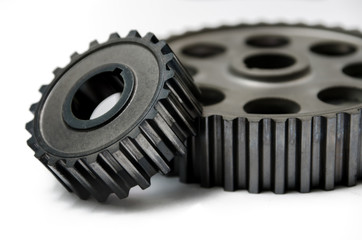 A gear wheel or pinion is a basic part of a gear train in the form of a disc with teeth on a cylindrical or conical surface meshing with the teeth of another gear