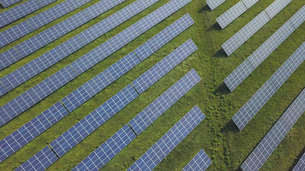 solar panels on grass, aerial view