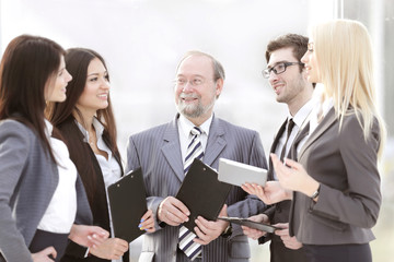 close up.a business team standing talking in the office