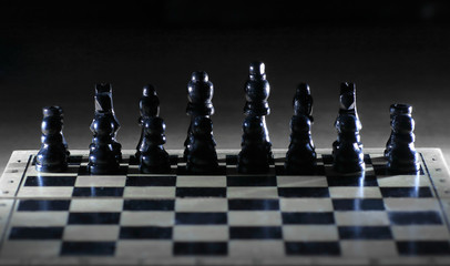 black chess pieces on the game Board.strategy concept