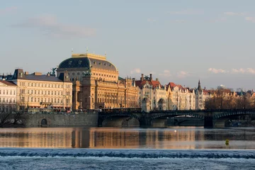 Deurstickers  Prague's Public theater view with old town street from Vltava river.  © Andrey