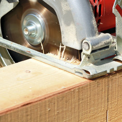 Electric circular saw for a wood cut.