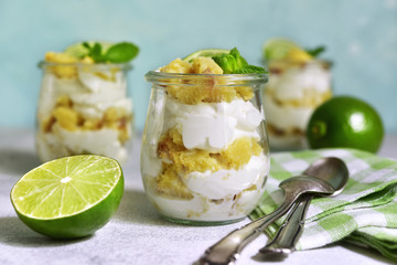 No baked lime cheesecake with mint in a vintage jar.