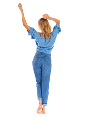 Young woman in blue jeans standing isolated on a white background
