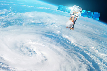 Research, probing, monitoring of tracking in a tropical storm zone, a hurricane. Satellite above the Earth makes measurements of the weather parameters. Elements of this image furnished by NASA.