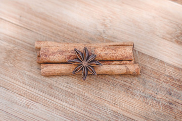cinnamon and star anise on a wooden board