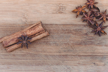 cinnamon and star anise on a wooden board