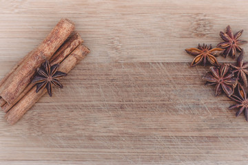 cinnamon and star anise on a wooden board