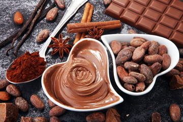 Chocolate bars on table with chocolate powder.
