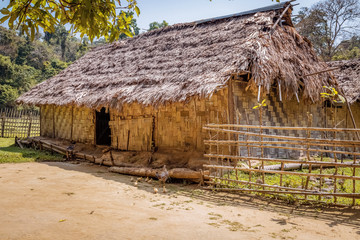 Fototapeta na wymiar Indian village house made of dry coconut leaf with thatched roof at Baratang island Andaman India.