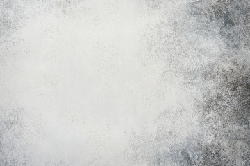 Light grey stone or slate wall.