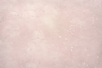 Light pink stone wall or floor.
