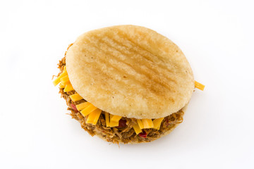 Arepa with shredded beef and cheese isolated on white background. Venezuelan typical food