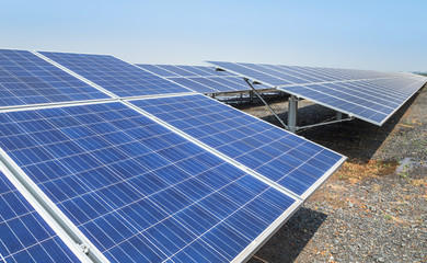 Close up rows array of polycrystalline silicon solar cells or photovoltaics in solar power plant...