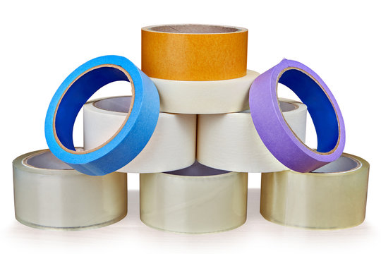 Set of adhesive tape is stacked in form of pyramid.