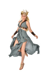 full length portrait of pretty blonde lady wearing fantasy toga gown,  and holding a bow and arrow. standing pose on white background. © faestock