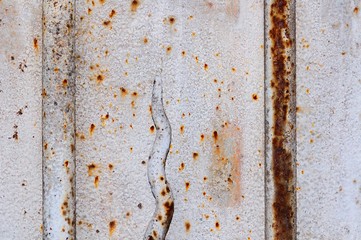 Very old and rusty iron gate detail. Useful for texture or background.