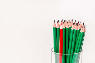 many green pencils and one red