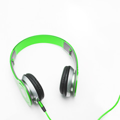 Fototapeta na wymiar Green headphone on white