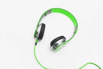 Green headphone on white