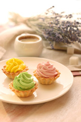 basket with cream. cake on plate