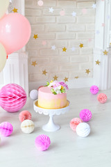 Cakes for holiday party. Decorations for holiday party. A lot of balloons pink and white colors. 