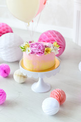 Cake for birthday party. Decorations for holiday party. A lot of balloons. 