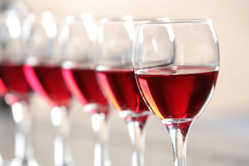 Glasses with delicious red wine, closeup