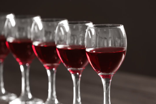 Glasses with delicious red wine, closeup