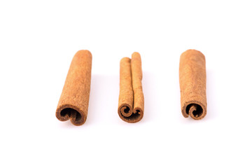 Fragrant cinnamon sticks isolated on white background