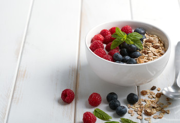 Smoothie bowl with yogurt, fresh berries and cereal