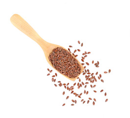 Some linseeds spread out on white background