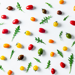 food pattern of colorful small tomatoes and arugula salad. backg