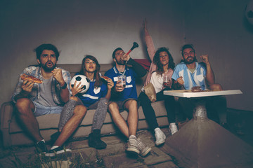 Watching a football game © Impact Photography
