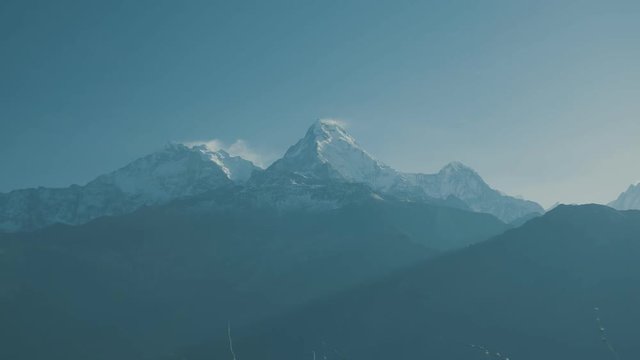 Time-lapse Dust of Snow blowing on Mountain before Sunrise view landscape from Poon Hill, Annapurna range in April 2