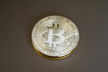 Digital bitcoin on a bronze background. Background.