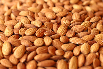 The almond on the counter of the store. Walnut background with soft focus.