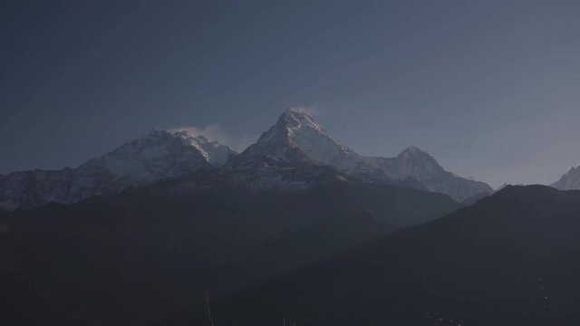 Time-lapse Dust of snow blowing on Mountain before Sunrise view landscape from Poon Hill, Annapurna range in April 
