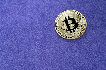 Digital bitcoin on a purple background.