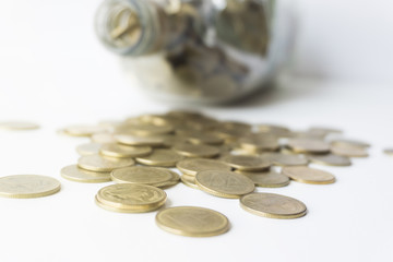 Golden coin in glass bottle, Saving money concept.