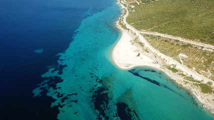 Fototapeta na wymiar Aerial drone bird's eye view photo of tropical caribbean sandy beach with emerald crystal clear waters