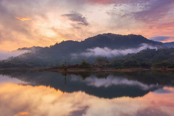 Naklejka na ściany i meble Beautiful landscape morning with rising sun on lake